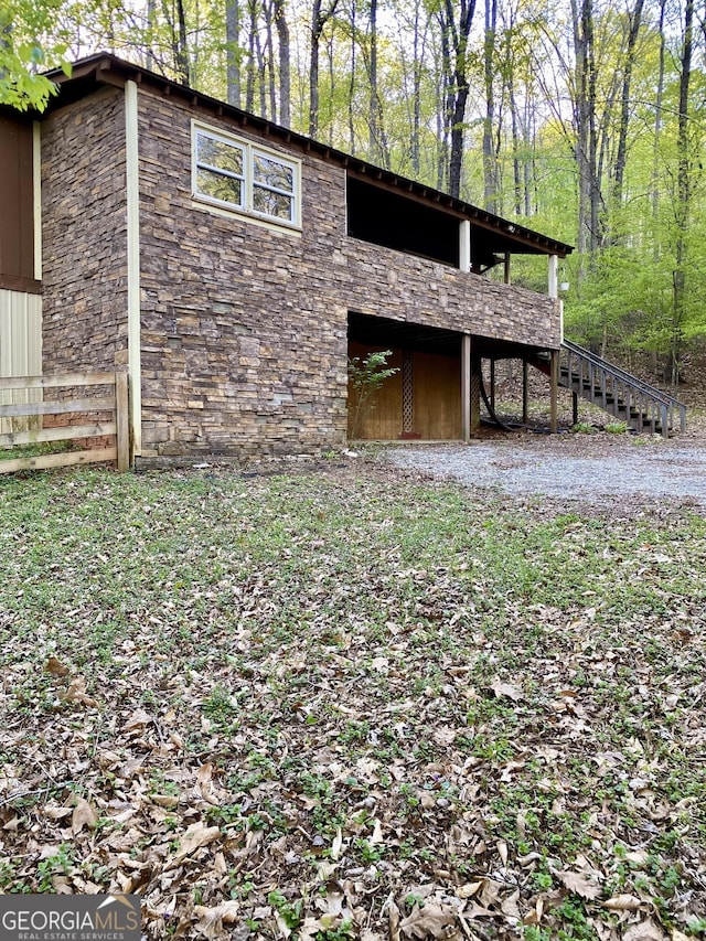 view of outbuilding with stairs