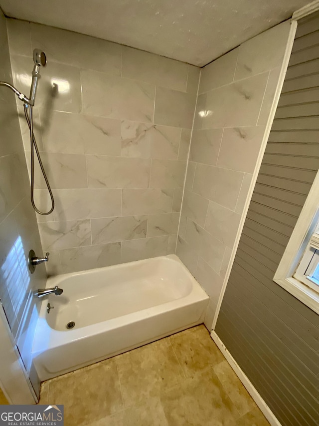 full bath with bathing tub / shower combination and tile patterned flooring