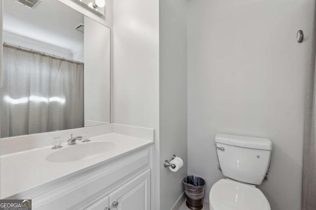 full bath with visible vents, vanity, and toilet