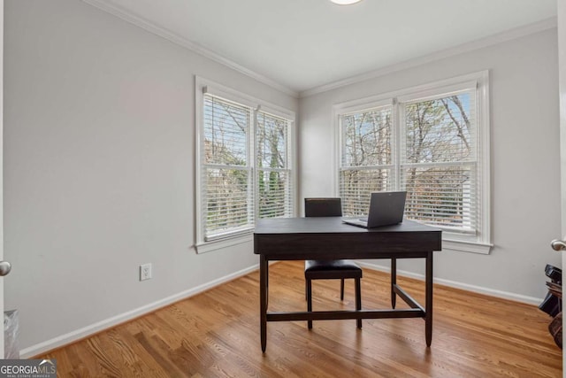 home office with baseboards, ornamental molding, and wood finished floors