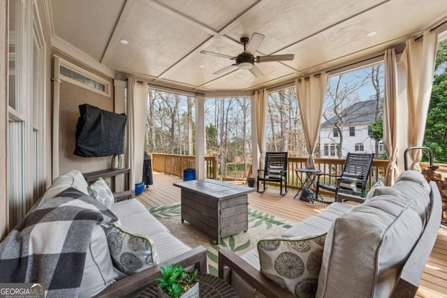 sunroom / solarium featuring coffered ceiling and ceiling fan