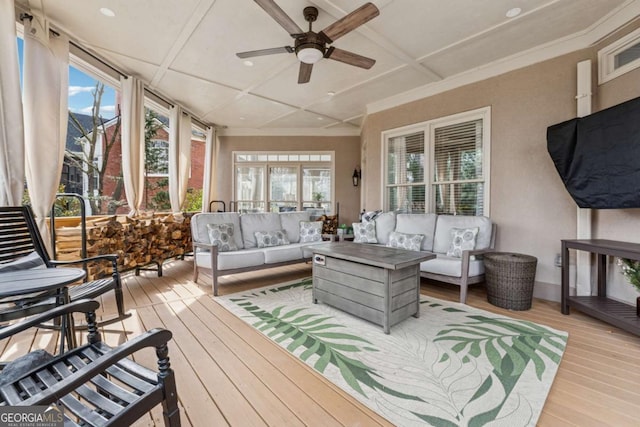 sunroom / solarium with ceiling fan and coffered ceiling