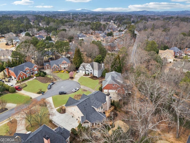 birds eye view of property with a residential view