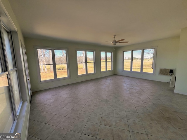 unfurnished sunroom with a wall unit AC