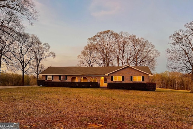 single story home with a front yard