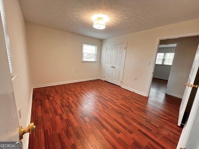 bathroom featuring wainscoting, tile walls, toilet, and vanity