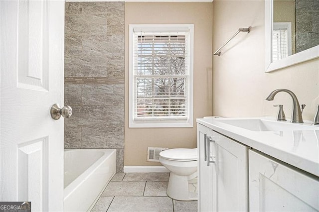 bathroom with visible vents, toilet, a tub, tile patterned floors, and vanity