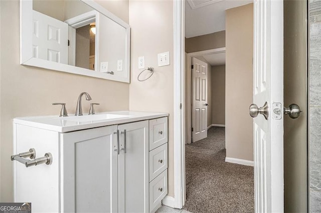 bathroom featuring vanity and baseboards