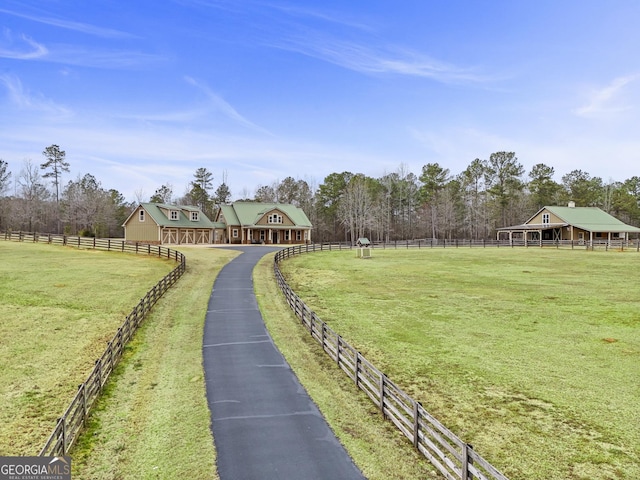 exterior space with a rural view and fence