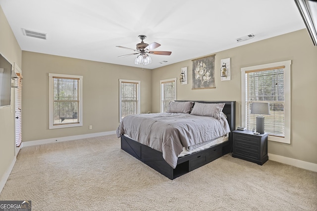 bedroom with carpet flooring, visible vents, and baseboards