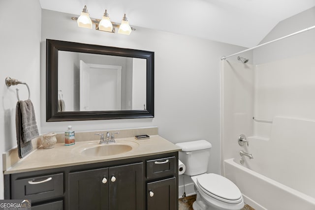 full bath with toilet, shower / bathing tub combination, lofted ceiling, and vanity