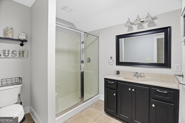 full bath featuring toilet, a stall shower, vanity, tile patterned flooring, and baseboards