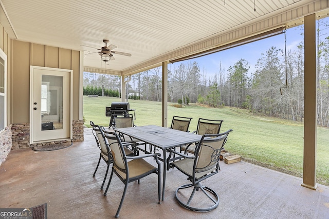 view of patio / terrace with ceiling fan and outdoor dining space