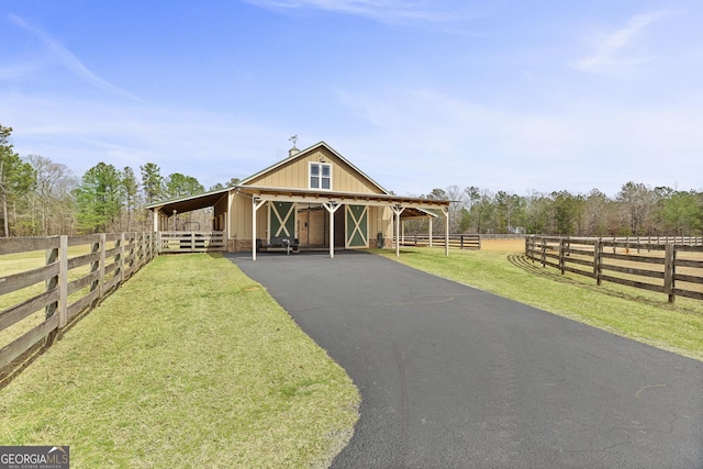 view of front of home featuring an outbuilding and an exterior structure