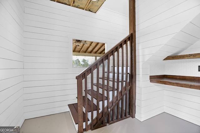 stairway with wooden walls