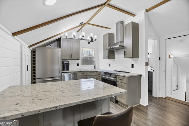 kitchen with lofted ceiling with beams, stainless steel appliances, gray cabinets, wall chimney range hood, and a sink