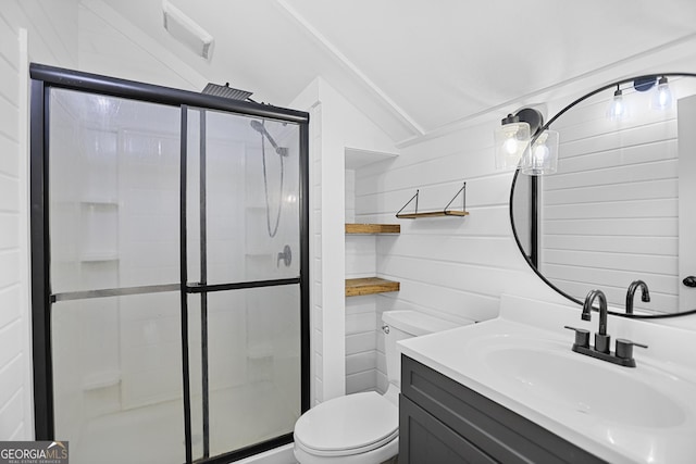 full bath featuring toilet, a stall shower, vaulted ceiling, and vanity