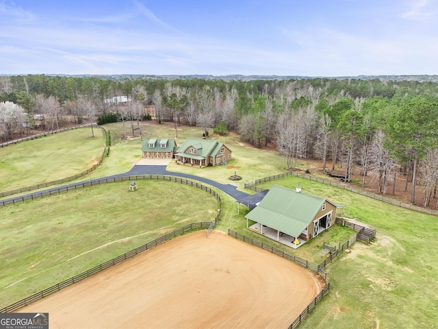 drone / aerial view featuring a forest view and a rural view