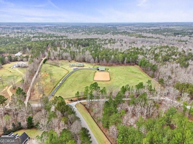 drone / aerial view featuring a view of trees