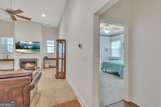 corridor with recessed lighting, carpet flooring, and baseboards