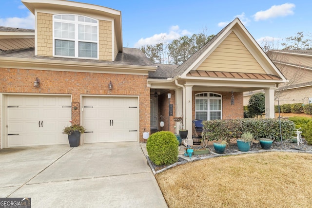 view of front of property with a garage, driveway, brick siding, and roof with shingles