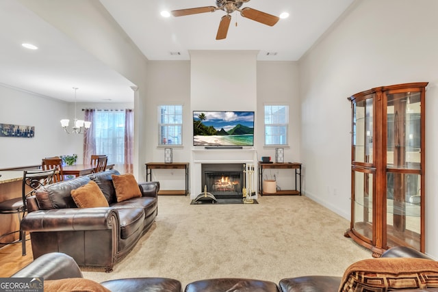 living area with carpet floors, a fireplace with flush hearth, a wealth of natural light, and baseboards