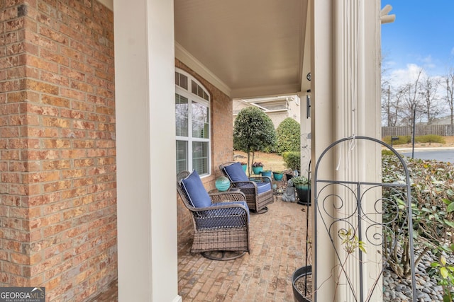 view of patio featuring a gate