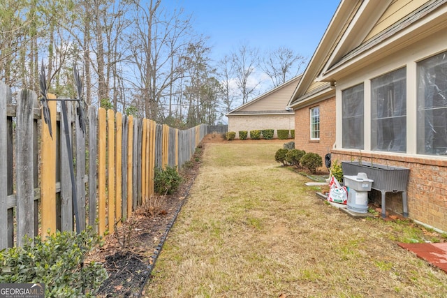 view of yard featuring a fenced backyard