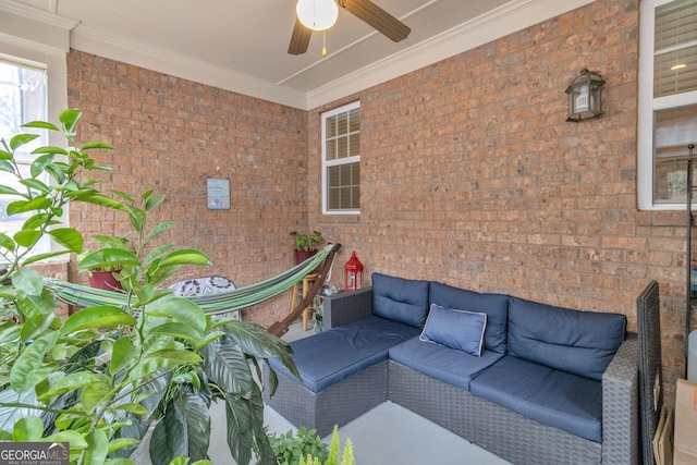 view of patio / terrace with ceiling fan and an outdoor living space