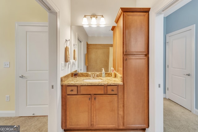 bathroom featuring vanity and baseboards