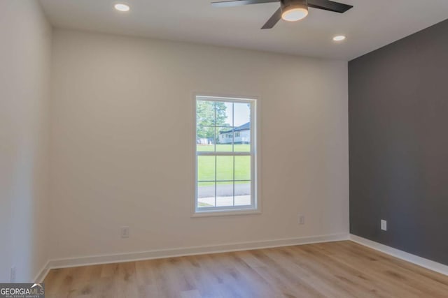 empty room with light wood-style floors, ceiling fan, baseboards, and recessed lighting