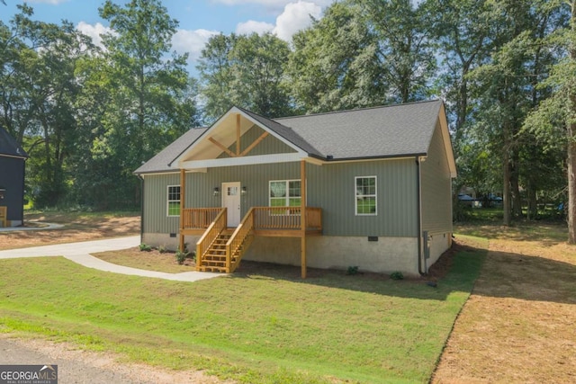 view of front of property featuring roof with shingles, crawl space, covered porch, stairs, and a front lawn