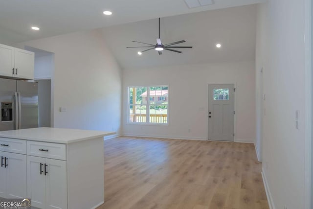 kitchen with recessed lighting, white cabinetry, baseboards, light countertops, and light wood-type flooring