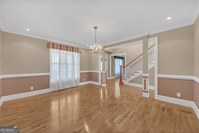 interior space with ornamental molding, stairway, baseboards, and wood finished floors