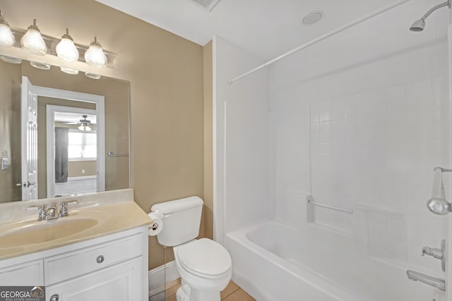 bathroom with shower / bathtub combination, toilet, vanity, baseboards, and tile patterned floors