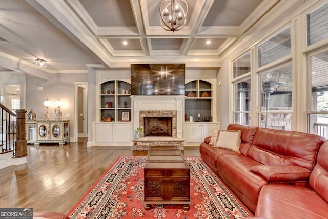 living room featuring a fireplace, ornamental molding, coffered ceiling, beamed ceiling, and stairs