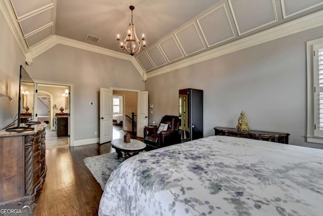 bedroom with lofted ceiling, arched walkways, a notable chandelier, visible vents, and dark wood-style floors