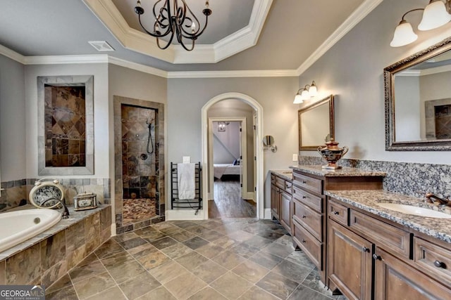 full bathroom with visible vents, a sink, a tile shower, crown molding, and a bath