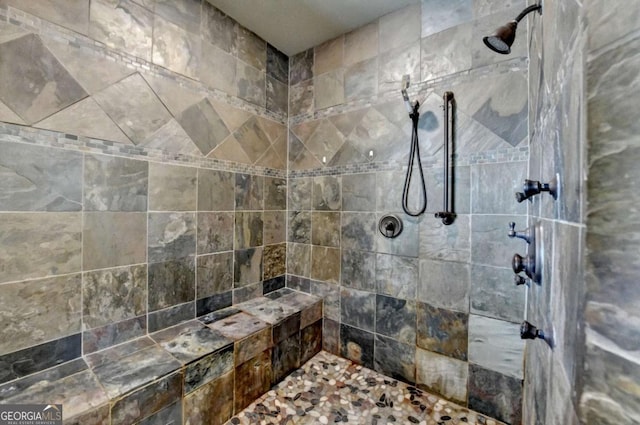 full bathroom with tiled shower