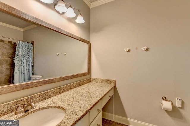 full bath featuring toilet, baseboards, crown molding, and vanity