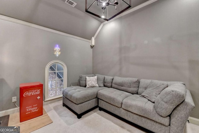 living room featuring baseboards, visible vents, vaulted ceiling, and crown molding