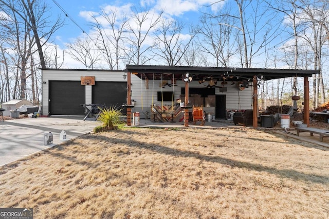 8718 Shade Tree Ct, Clermont, GA 30527 - view of outdoor structure with a garage and concrete driveway