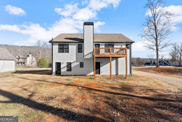 8718 Shade Tree Ct, Clermont, GA 30527 - back of property featuring a chimney and a wooden deck