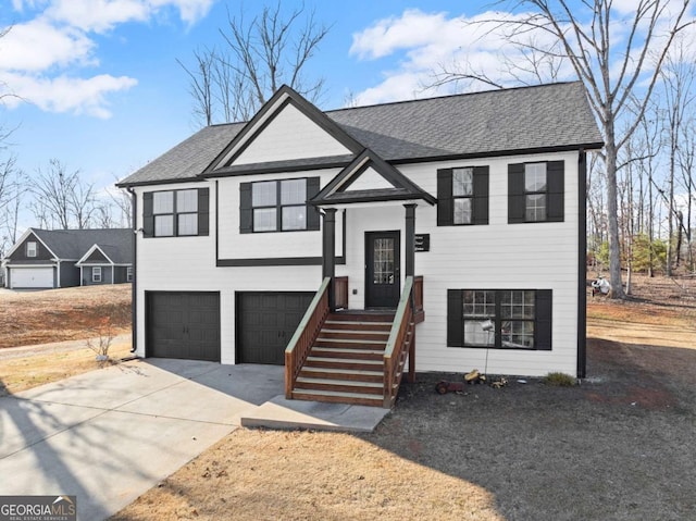 8718 Shade Tree Ct, Clermont, GA 30527 - split foyer home featuring an attached garage, driveway, and a shingled roof
