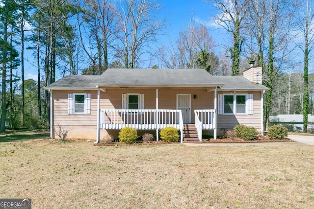 37 Indian Hills Ct, Dallas, GA 30157 - view of front facade featuring a chimney, a front lawn, and covered porch