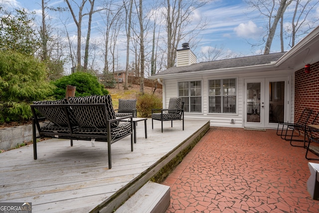 wooden deck featuring french doors