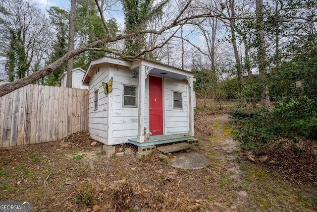 view of shed with fence