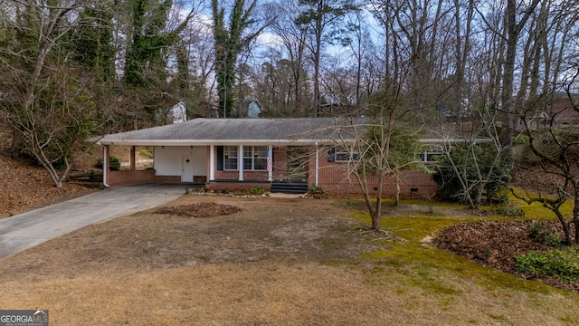 single story home with driveway, an attached carport, crawl space, and brick siding