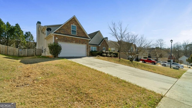 view of home's exterior with a garage, concrete driveway, fence, and a lawn