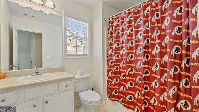 bathroom with a shower with shower curtain, visible vents, vanity, and toilet